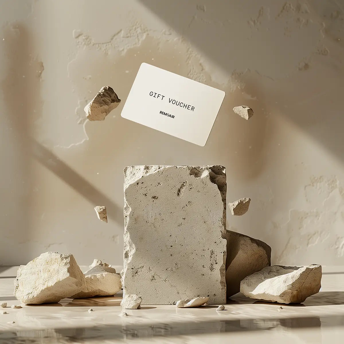 ett presentkort svävar ovanför ett stort betongblock som krossas
